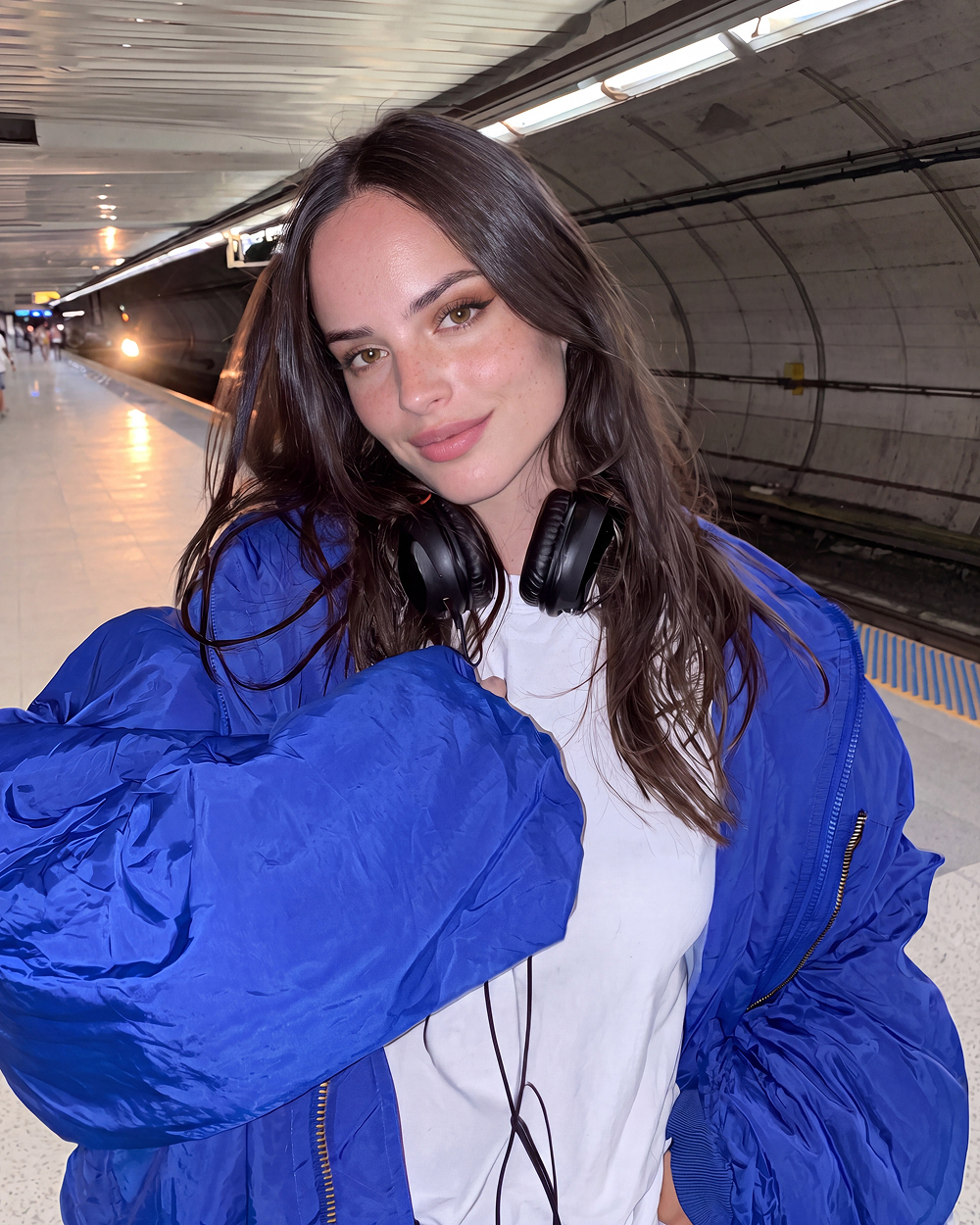 blue jacket subway headphones