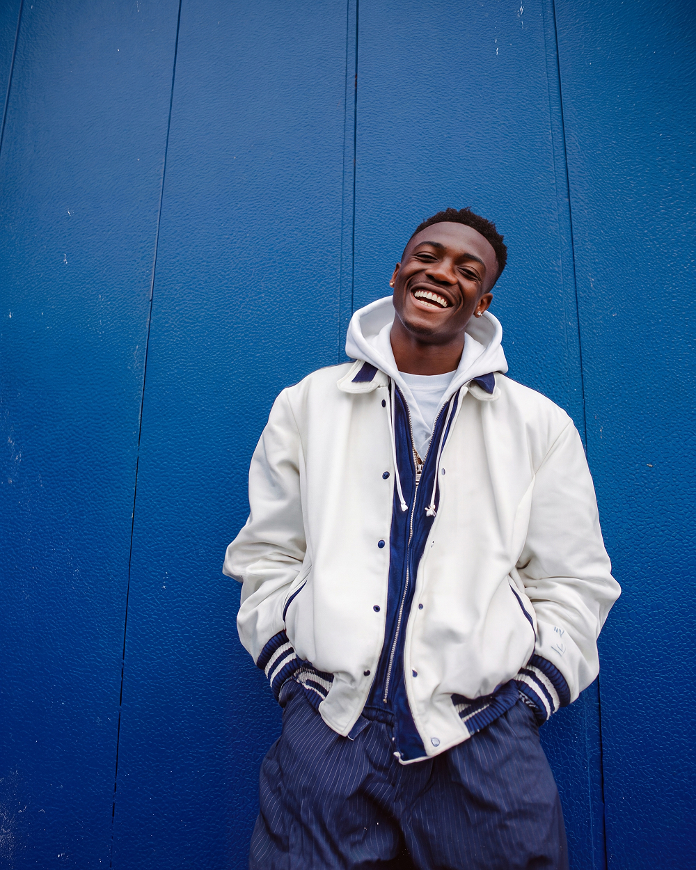 varsity jacket blue wall