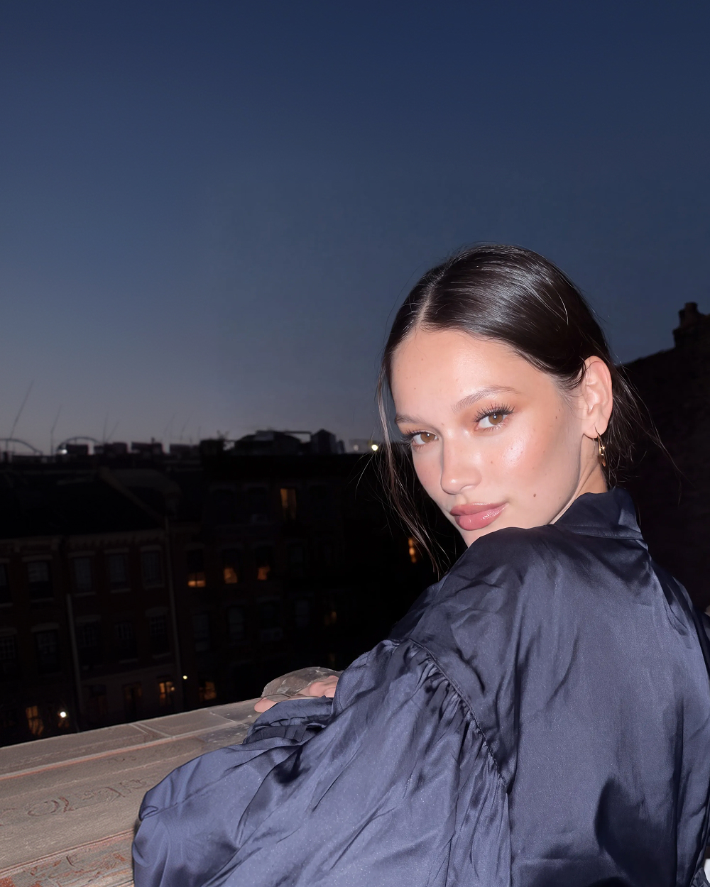 woman rooftop dusk